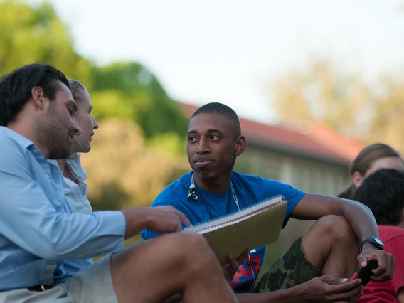 Students talking outside at the University of Arizona.