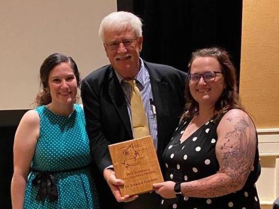 Picture of Ed Franklin and Amber Rice holding their award