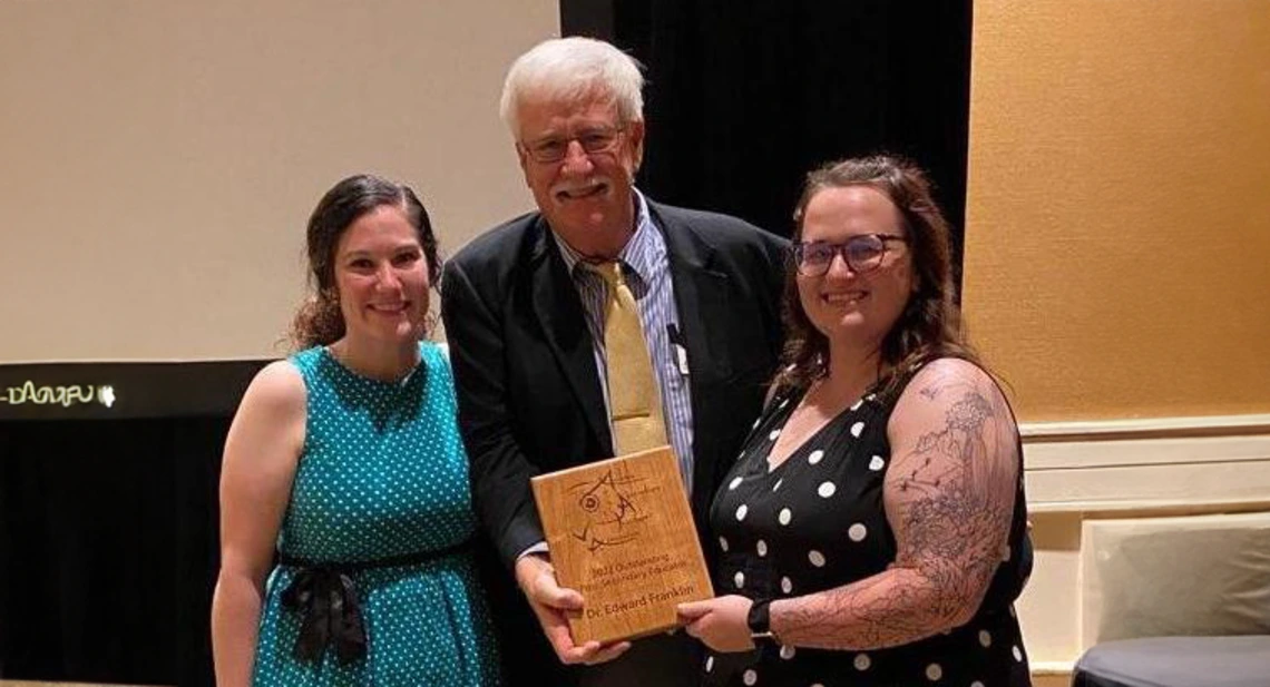 Picture of Ed Franklin and Amber Rice holding their award