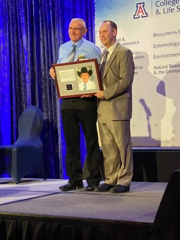 Picture of Jose Bernal holding award